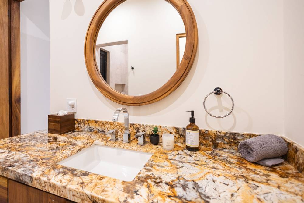 Vanity with round teak mirror